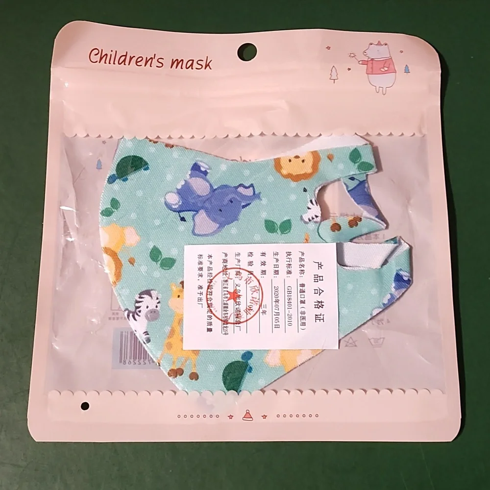 Children's re Usable face mask new in package never opened